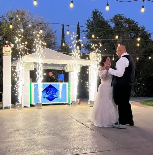 The Perfect Wedding Setup: Antari Dancing in the Cloud Fog Machine, RCF 12s, and the Prism DJ Booth Facade
